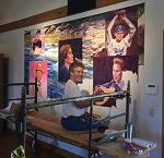 Artist Michael McClure at work on a mural now displayed at the Ozark Heritage Welcome Center in West Plains, Missouri